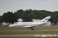 N875TM @ KSRQ - Raytheon Hawker 800 (N875TM) departs Sarasota-Bradenton International Airport - by Donten Photography