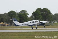 N2879C @ KSRQ - Piper Cherokee (N2879C) departs Sarasota-Bradenton International Airport - by Donten Photography