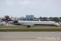 N914FJ @ KSRQ - US Air Flight 2884 operated by Mesa (N914FJ) taxis at Sarasota-Bradenton International Airport - by Donten Photography