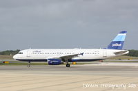 N521JB @ KSRQ - JetBlue Flight 164 (N521JB) Baby Blue prepares for flight at Sarasota-Bradenton International Airport - by Donten Photography