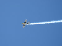 N1038A @ CMA - 1944 North American SNJ-5 'WAR DOG', P&W R-1340 Wasp 600 Hp, low level airshow with smoke - by Doug Robertson