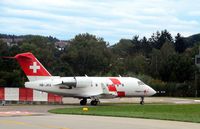 HB-JRA @ LSZH - Swiss Air Rescue (Rega) Bombardier airplane after landing at Zurich-Kloten International Airport, photo through airplane window. - by miro susta