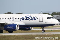 N594JB @ KSRQ - JetBlue Flight 164 (N594JB) Whole Lotta Blue prepares for flight at Sarasota-Bradenton International Airport - by Donten Photography