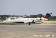 N744EV @ KSRQ - Delta Flight 4935 operated by ExpressJet (N744EV) arrives at Sarasota-Bradenton International Airport following a flight from LaGuardia Airport - by Donten Photography