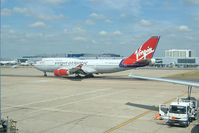G-VROM @ EGKK - A Virgin Atlantic 747 moves out of its gate at London's Gatwick Airport - by Ron Coates