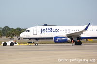 N828JB @ KSRQ - JetBlue Flight 164 (N828JB) Simon Says Fly JetBlue prepares for flight at Sarasota-Bradenton International Airport - by Donten Photography