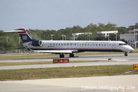 N911FJ @ KSRQ - US Air Flight 2681 operated by Mesa (N911FJ) arrives at Sarasota-Bradenton International Airport following a flight from Charlottte-Douglas International Airport - by Donten Photography