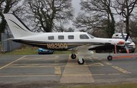 N921GG @ EGHH - Being towed to paintshop - by John Coates