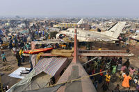 F-GESJ @ FEFF - People gather at camp for internally displaced persons set up amid old aircrafts near the airport in Bangui on December 29, 2013. (MIGUEL MEDINA/AFP/Getty Images) - by MIGUEL MEDINA