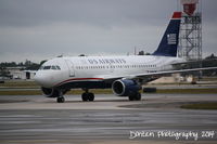 N746UW @ KSRQ - US Air Flight 2015 (N746UW) arrives at Sarasota-Bradenton International Airport following a flight from Charlotte-Douglas International Airport - by Donten Photography