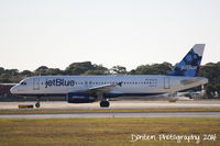 N634JB @ KSRQ - JetBlue Flight 431 (N634JB) B*L*U*E arrives at Sarasota-Bradenton International Airport following a fligh from Laguadia Airport - by Donten Photography