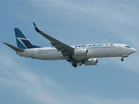 C-GWWJ @ CYYZ - This 2008 Westjet 737 prepares to land on rwy 24R at Toronto Int'l Airport - by Ron Coates