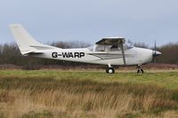 G-WARP @ EGFH - Visiting Cessna Skylane holding prior to departure. - by Roger Winser