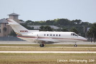 N321MS @ KSRQ - Raytheon Hawker 800 (N321MS) taxis at Sarasota-Bradenton International Airport - by Donten Photography