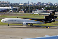 N282UP @ YSSY - TAXIING TO CARGO AREA - by Bill Mallinson