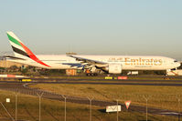 A6-ECG @ YSSY - TAXIING TO TERMINAL - by Bill Mallinson