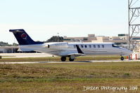N821LC @ KSRQ - Learjet 45 (N821LC) taxis at Sarasota-Bradenton International Airport - by Donten Photography