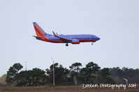 N422WN @ KMCO - Southwest Flight 2283 (N422WN) arrives at Orlando International Airport following a flight from  San Antionio International Airport - by Donten Photography