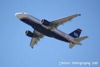 N745UW @ KSRQ - US Air Flight 1801 (N754UW) departs Sarasota-Bradenton International Airport enroute to Charlotte-Douglas International Airport - by Donten Photography