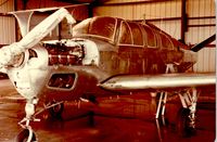 N1427G @ F41 - P35 Bonanza N1427G at Poplawski Aircraft Paint in Ennis, TX (1980) - by Mark McCauley