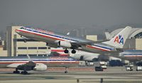N930AN @ KLAX - Departing LAX on 25R - by Todd Royer
