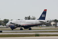 N757UW @ KSRQ - US Air Flight 1801 (N757UW) departs Sarasota-Bradenton International Airport enroute to Charlotte-Douglas International Airport - by Donten Photography