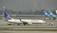 HP-1831CMP @ KLAX - Getting towed to gate - by Todd Royer