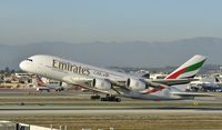 A6-EEP @ KLAX - Departing LAX on 25L - by Todd Royer