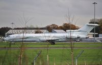 VP-CZY @ EGHH - Parked in the trees - by John Coates