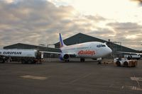 G-GDFK @ EGHH - Fuelling up in failing light after repaint - by John Coates