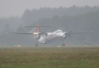 VT-SUO @ EGHH - Bad weather departure on delivery - by John Coates