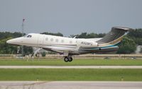 N328FL @ ORL - Flight Options Phenom 300 - by Florida Metal