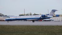 N519LR @ MIA - United Express CRJ-700 - by Florida Metal