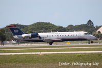 N433AW @ KSRQ - US Air Flight 4078 (N433AW) arrives at Sarasota-Bradenton International Airport following a flight from Reagan National Airport - by Donten Photography