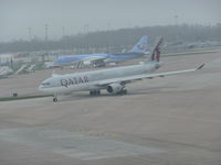 A7-AEN @ EGCC - aircaft now free from the tug taxing out from T2 for take offphoto taken from the top floor of the carpark. - by packo