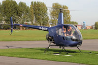 G-BSCE @ EGBR - Robinson R22 Beta at The Real Aeroplane Club's Pre-Hibernation Fly-In, Breighton Airfield, October 2013. - by Malcolm Clarke