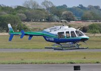 N199F @ EGFH - Brief visit by a Bell 407 helicopter. - by Roger Winser