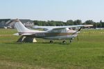 N10DB @ OSH - 1977 Cessna 210M, c/n: 21062016 - by Timothy Aanerud