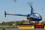 G-MOGY @ EGNT - Robinson R22 Beta, Newcastle Airport, May 2014. - by Malcolm Clarke