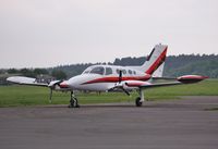 N60FR @ EGHH - Parked at Sigs - by John Coates