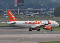 G-EZWU @ EHAM - Taxi to runway 18L of Schiphol Airport - by Willem Göebel