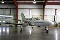 N345TP @ KIOW - Among aircraft displayed in a hangar during the air show