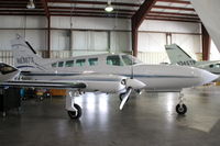 N6387X @ KIOW - Among aircraft displayed in a hangar during the air show