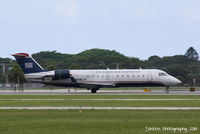 N425AW @ KSRQ - US Air Flight 4023 operated by Air Wisconsin (N425AW) arrives at Sarasota-Bradenton International Airport following a flight from Reagan National Airport - by Donten Photography