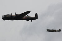 PA474 @ EGVA - RIAT 2014, Lancaster B1, seen leading Spitfire LF.IXc, of the Battle of Britain Memorial Flight, overflying the Domestc Site at RAF Fairford.