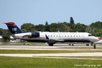 N432AW @ KSRQ - US Air Flight 4026 operated by Air Wisconsin (N432AW) arrives at Sarasota-Bradenton International Airport following a flight from Reagan National Airport - by Donten Photography