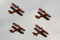 N5057V @ EGVA - RIAT 2014, A75N1, Breitling Wingwalkers, overflying the Domestic Site at RAF Fairford. - by Derek Flewin