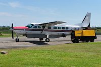 G-EELS @ EGFH - Visiting Grand Caravan fitted with a TV camera to cover a golf tournament. - by Roger Winser