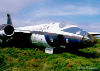 WT308 @ EGDO - Scanned from print. Canberra WT308 pictured within the fire training area at Predannack, Cornwall July '97 - by Clive Pattle