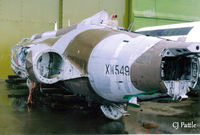 XW549 @ EGQK - Scanned from print. Remains of Buccanear S.2B XW549/8860M still serving a purpose at the Battle Damage Repair Training facility at RAF Kinloss, Feb '96. In the rear is a fuselage from Comet 4C XR396/G-BDIU/8882M serving the same purpose. - by Clive Pattle